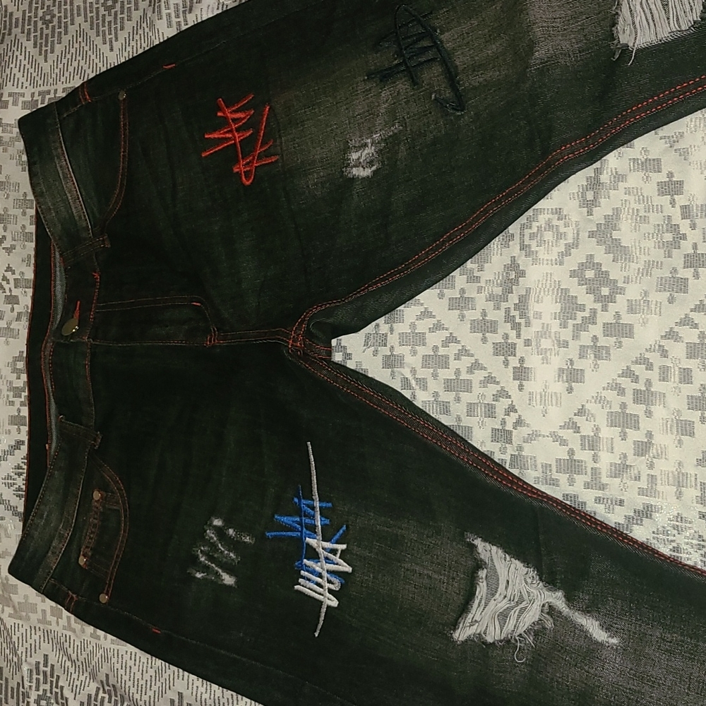 Black ripped fashionable jeans